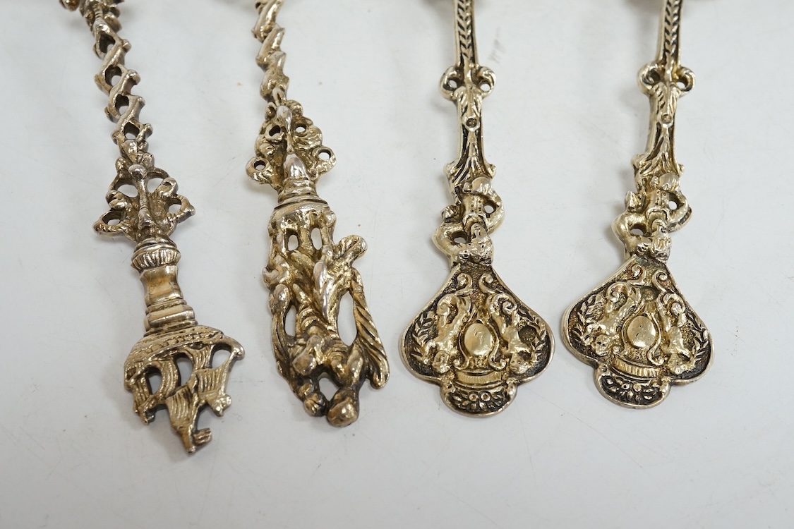 Four 19th century Dutch gilt white metal spoons, including a pair with import marks for Louis Landsberg, London, 1890, 83mm, 7.2oz.